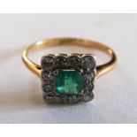 A square cluster emerald and diamond ring on gold coloured band (marks obscured) size N/O
