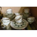 A Royal Doulton Orion teaset:- two bread plates, twelve plates, twelve saucers, ten cups, sucrier