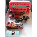 A Matchbox Ferrari Dino, modern Dinky Triumph, three other cars, Deagostive set, plastic bus and