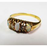 An 18ct gold ring opal and diamond size U/V