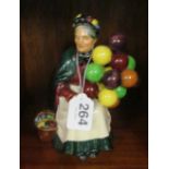 A Royal Doulton figure The Old Balloon Seller