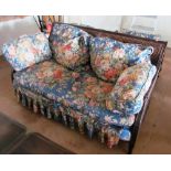 A three piece bergere suite comprising 2 seater settee and pair similar armchairs
