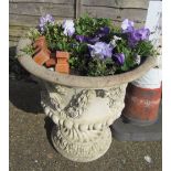 A stoneware garden urn