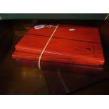 Four stamp albums red folders