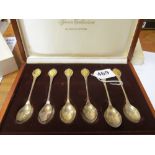 A cased set of silver spoons 'The Sovereign Queens spoon collection' and a £2 coin in presentation