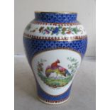 A Copeland Spode vase decorated reserves of exotic birds (hairline crack)