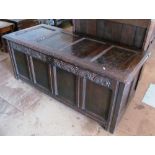A 17th Century oak coffer with carved lunette frieze