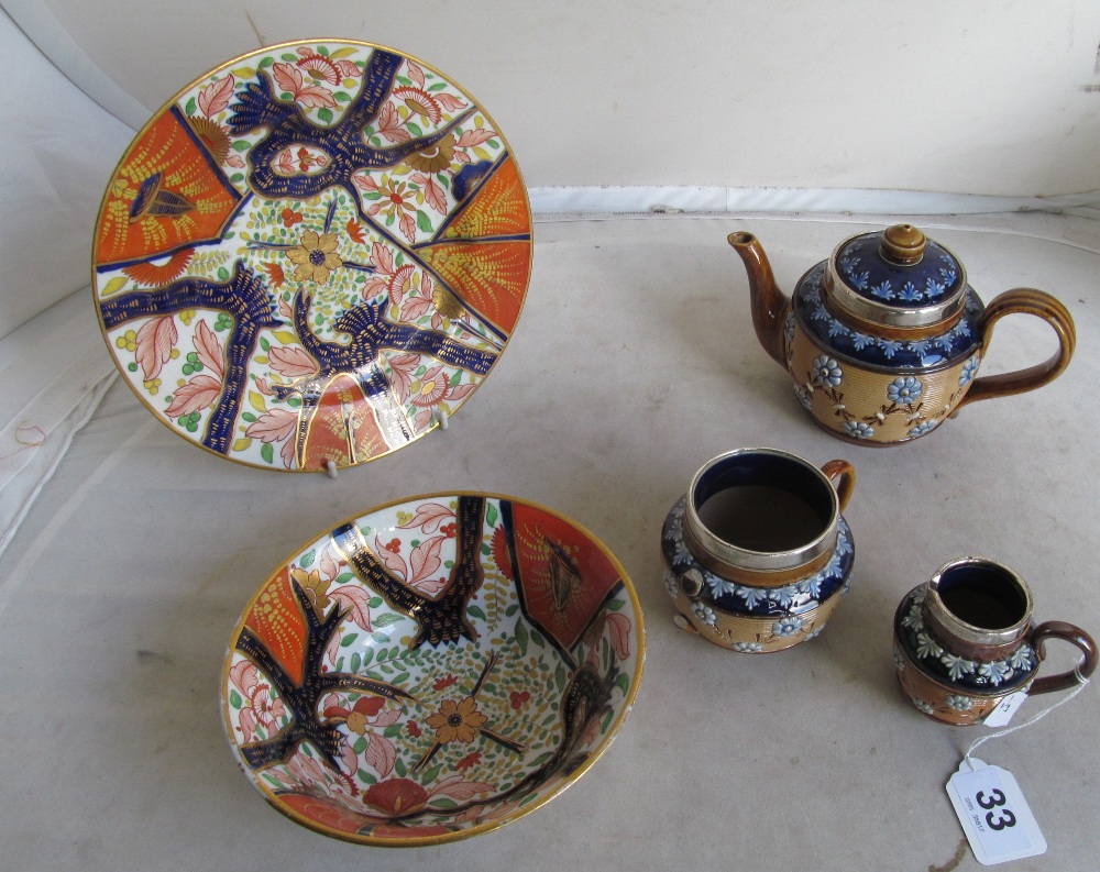 A 19th Century english Imari bowl and plate and a Royal Doulton teapot, sugar bowl and jug with