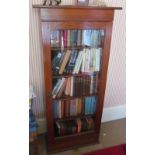 A narrow oak cabinet