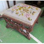 A tapestry top footstool on pierced scroll supports