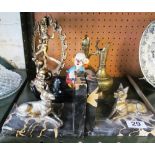 A pair of marble bookends with alsations lying down, two eastern brass ewers, a brass deity statue