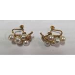A pair of 14k pearl and leaf earrings