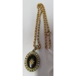 An oval locket on 9ct chain 11.88 g