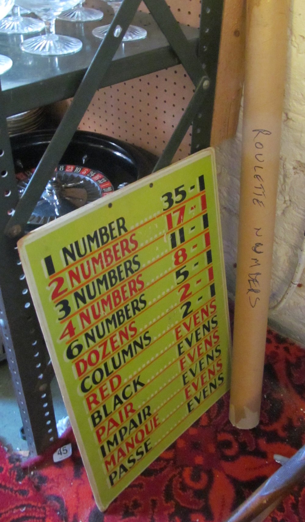 A roulette wheel with betting boards and number mat