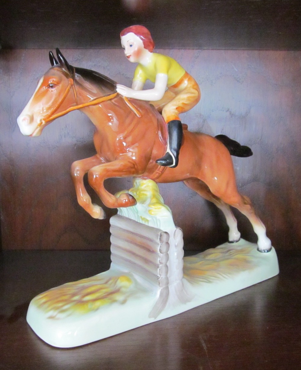 A Beswick Girl Jumping on horseback