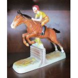 A Beswick Girl Jumping on horseback