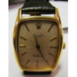 A gold Rolex Cellini watch