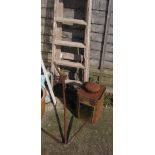 A vintage wooden ladder, anchor and a cannister with window