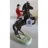 A Beswick rearing brown horse with huntsman No 868