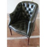 A leather button upholstered tub shaped chair on ring turned supports