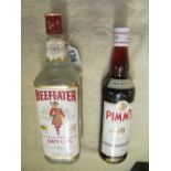 A Beefeater gin 1.14ltr and a bottle of Pimms 70cl