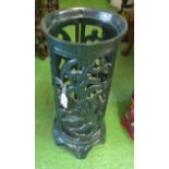 A green pierced floral metal stickstand