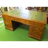 A late 19th Century mahogany partner's desk, nine drawers each side, leather inset top (some handles