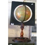 A Philips Terrestrial Globe on mahogany stand and square surround