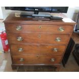 An early 19th Century mahogany chest of four graduated long drawers