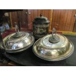 A pair of silver-plated entree dishes and a biscuit barrel