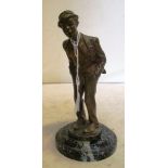 A bronze model of a tramp on marble base