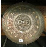 An Indian silver coloured and copper charger