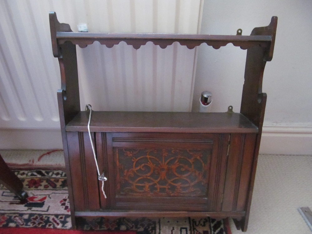 A carved wall cabinet