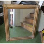 A gilt framed mirror