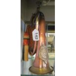 A copper and brass bugle with tassel