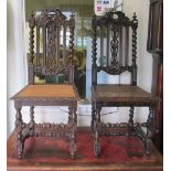 A pair of oak cane seated chairs