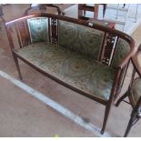 An Edwardian mahogany three piece salon suite:- settee and two chairs