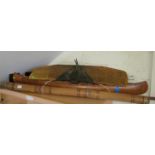 A handmade American canoe, an oar, diggery doo and plane wing