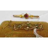 A gold peridot and pearl brooch and 9ct gold single stone brooch 1.2g