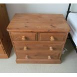 A small modern pine chest two short and two long drawers