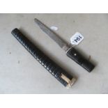 A Japanese dagger in ribbed case