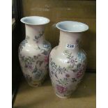 A pair of modern oriental pink floral vases (one chipped to rim)