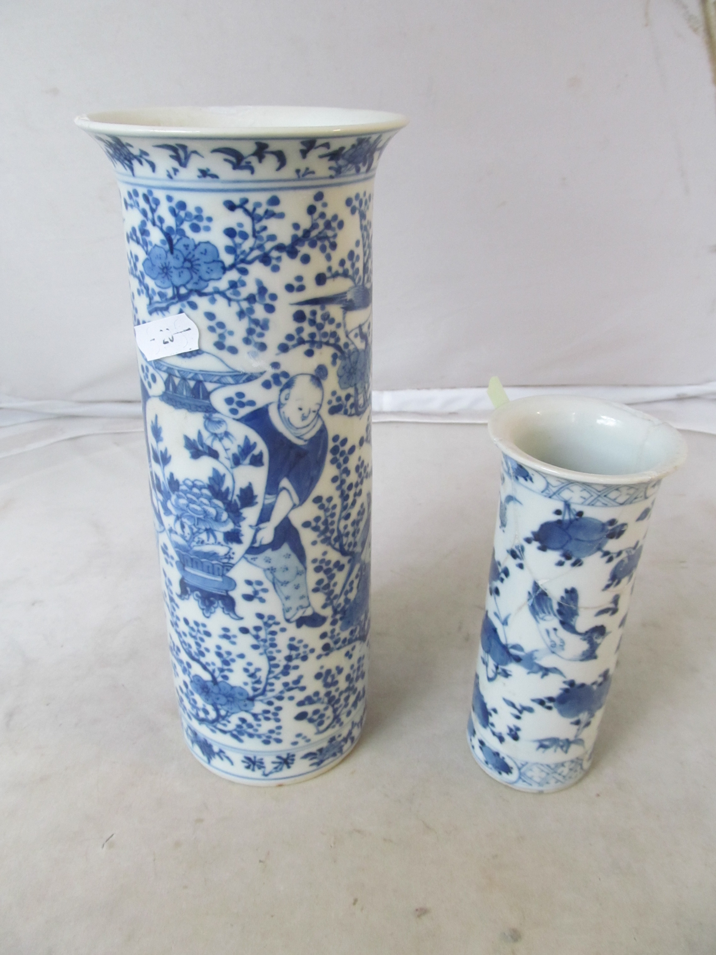 A modern Chinese bowl decorated butterflies and flowers (a/f) and two blue and white vases (a/f)