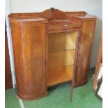 A 1940s walnut display cabinet with central glazed door and two side cupboards