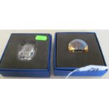 A paperweight etched lions head and another etched horse and foal (both boxed)