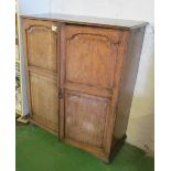 An oak cabinet with reversible doors