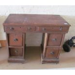 A small pine twin pedestal desk