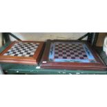 A framed reverse painted on glass chess board and a marble and treen chess board