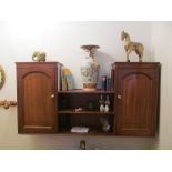A wall cabinet cupboards to each end