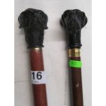 Two walking canes with dog head handles